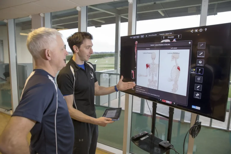 Alex from Golf Fit chatting with a client